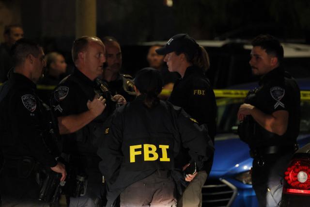 FBI agents are seen outside the home of the alleged White House Correspondents Dinner shooter in Torrance, California, on April 25, 2026. US President Donald Trump said April 25 he would give a press conference from the White House press briefing room, shortly after a shooting incident at a gala dinner in Washington. The press conference is set to take place shortly after 10 p.m. (0200 GMT), Trump wrote on his Truth Social platform, adding: "The First Lady, plus the Vice President, and all Cabinet members, are in perfect condition." (Photo by Patrick T. Fallon / AFP)