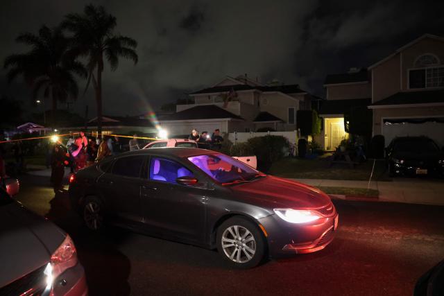 An FBI agent in a vehicle crosses a police line as they arrive near the home of the alleged White House Correspondents Dinner shooter in Torrance, California, on April 25, 2026. US President Donald Trump said April 25 he would give a press conference from the White House press briefing room, shortly after a shooting incident at a gala dinner in Washington. The press conference is set to take place shortly after 10 p.m. (0200 GMT), Trump wrote on his Truth Social platform, adding: "The First Lady, plus the Vice President, and all Cabinet members, are in perfect condition." (Photo by Patrick T. Fallon / AFP)