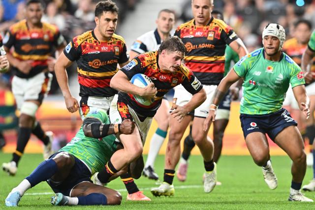 Chiefs' Isaac Hutchinson (C) ss tackled by Fijian Drua's defence during the Super Rugby Pacific match between the Chiefs and Fijian Drua at One New Zealand Stadium in Christchurch on April 26, 2026. (Photo by Sanka VIDANAGAMA / AFP)