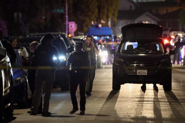 FBI agents are seen behind police tape near a residence associated with the alleged White House Correspondents Dinner shooter in Torrance, California, on April 25, 2026. US President Donald Trump said April 25 he would give a press conference from the White House press briefing room, shortly after a shooting incident at a gala dinner in Washington. The press conference is set to take place shortly after 10 p.m. (0200 GMT), Trump wrote on his Truth Social platform, adding: "The First Lady, plus the Vice President, and all Cabinet members, are in perfect condition." (Photo by Patrick T. Fallon / AFP)