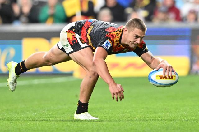 Chiefs' Cortez Ratima scores a try during the Super Rugby Pacific match between the Chiefs and Fijian Drua at One New Zealand Stadium in Christchurch on April 26, 2026. (Photo by Sanka VIDANAGAMA / AFP)
