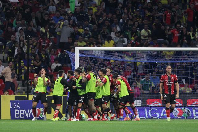 Players of Atlas celebrate after winning the Liga MX Clausura football match between America and Atlas at Banorte Stadium in Mexico City on April 25, 2026. (Photo by Victor Cruz / AFP)