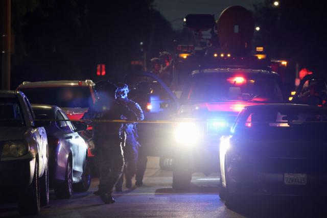An FBI tactical team arrives in armored vehicles outside a house associated with the suspected White House Correspondents Dinner shooter as in Torrance, California, on April 25, 2026. US President Donald Trump said April 25 he would give a press conference from the White House press briefing room, shortly after a shooting incident at a gala dinner in Washington. The press conference is set to take place shortly after 10 p.m. (0200 GMT), Trump wrote on his Truth Social platform, adding: "The First Lady, plus the Vice President, and all Cabinet members, are in perfect condition." (Photo by Patrick T. Fallon / AFP)