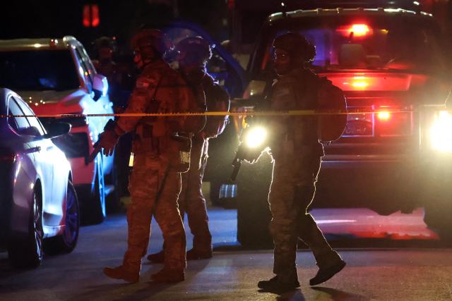 An FBI tactical team arrives in armored vehicles outside a house associated with the suspected White House Correspondents Dinner shooter as in Torrance, California, on April 25, 2026. US President Donald Trump said April 25 he would give a press conference from the White House press briefing room, shortly after a shooting incident at a gala dinner in Washington. The press conference is set to take place shortly after 10 p.m. (0200 GMT), Trump wrote on his Truth Social platform, adding: "The First Lady, plus the Vice President, and all Cabinet members, are in perfect condition." (Photo by Patrick T. Fallon / AFP)