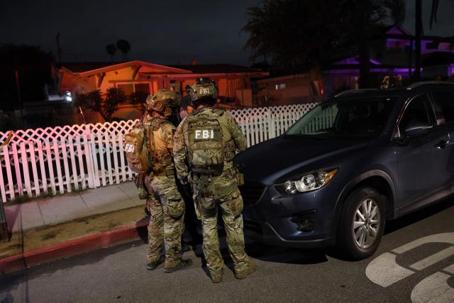 An FBI tactical team prepares to enter a house associated with the suspected White House Correspondents Dinner shooter in Torrance, California, on April 25, 2026. US President Donald Trump said April 25 he would give a press conference from the White House press briefing room, shortly after a shooting incident at a gala dinner in Washington. The press conference is set to take place shortly after 10 p.m. (0200 GMT), Trump wrote on his Truth Social platform, adding: "The First Lady, plus the Vice President, and all Cabinet members, are in perfect condition." (Photo by Patrick T. Fallon / AFP)