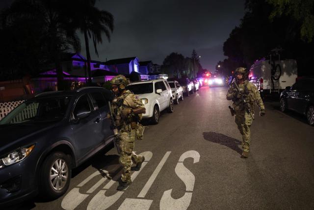 An FBI tactical team prepares to enter a house associated with the suspected White House Correspondents Dinner shooter in Torrance, California, on April 25, 2026. US President Donald Trump said April 25 he would give a press conference from the White House press briefing room, shortly after a shooting incident at a gala dinner in Washington. The press conference is set to take place shortly after 10 p.m. (0200 GMT), Trump wrote on his Truth Social platform, adding: "The First Lady, plus the Vice President, and all Cabinet members, are in perfect condition." (Photo by Patrick T. Fallon / AFP)