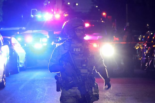 An FBI tactical team prepares to enter a house associated with the suspected White House Correspondents Dinner shooter in Torrance, California, on April 25, 2026. US President Donald Trump said April 25 he would give a press conference from the White House press briefing room, shortly after a shooting incident at a gala dinner in Washington. The press conference is set to take place shortly after 10 p.m. (0200 GMT), Trump wrote on his Truth Social platform, adding: "The First Lady, plus the Vice President, and all Cabinet members, are in perfect condition." (Photo by Patrick T. Fallon / AFP)