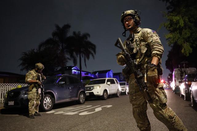 An FBI tactical team prepares to enter a house associated with the suspected White House Correspondents Dinner shooter in Torrance, California, on April 25, 2026. US President Donald Trump said April 25 he would give a press conference from the White House press briefing room, shortly after a shooting incident at a gala dinner in Washington. The press conference is set to take place shortly after 10 p.m. (0200 GMT), Trump wrote on his Truth Social platform, adding: "The First Lady, plus the Vice President, and all Cabinet members, are in perfect condition." (Photo by Patrick T. Fallon / AFP)