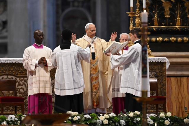 Pope Leo XIV (C) presides over the Holy Mass with Priestly Ordinations, at St Peter's Basilica in the Vatican on April 26, 2026. (Photo by Andreas SOLARO / AFP)