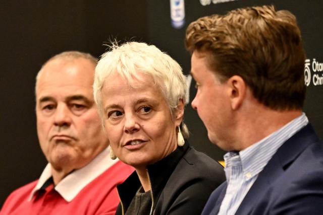 ChristchurchNZ's CEO Ali Adams (C) speaks to the media as Crusaders CEO Colin Mansbridge (L) and Super Rugby Pacific CEO Jack Mesley (R) look on during a press conference at One New Zealand Stadium in Christchurch on April 26, 2026. (Photo by Sanka VIDANAGAMA / AFP)