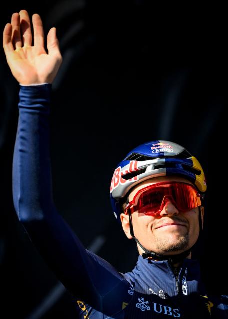 Pinarello Q36.5 Pro Cycling Team 's British rider Tom Pidcock gestures ahead of the start of the men elite race of the Liege-Bastogne-Liege UCI World Tour one day cycling race, 259,5km from Liege, over Bastogne to Liege, on April 26, 2026. (Photo by MAARTEN STRAETEMANS / Belga / AFP) / Belgium OUT