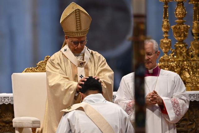 Pope Leo XIV (top C) presides over the Holy Mass with Priestly Ordinations, at St Peter's Basilica in the Vatican on April 26, 2026. (Photo by Andreas SOLARO / AFP)