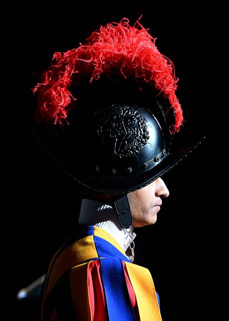 A Swiss guard looks on during the Holy Mass with Priestly Ordinations, at St Peter's Basilica in the Vatican on April 26, 2026. (Photo by Andreas SOLARO / AFP)