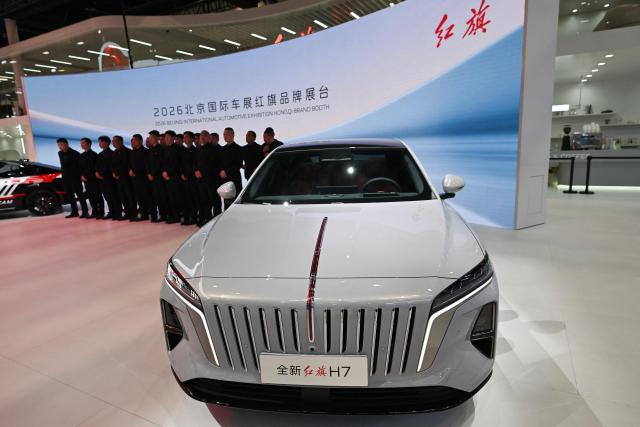 A Hongqi H7 is displayed at the Beijing Auto Show in Beijing on April 26, 2026. (Photo by Pedro PARDO / AFP)