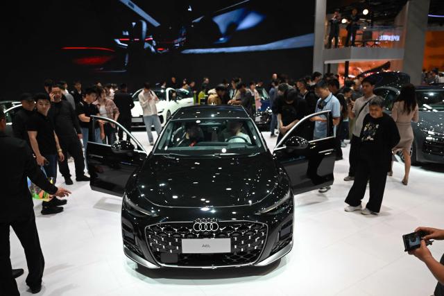 An Audi A6L is displayed at the Beijing Auto Show in Beijing on April 26, 2026. (Photo by Pedro PARDO / AFP)