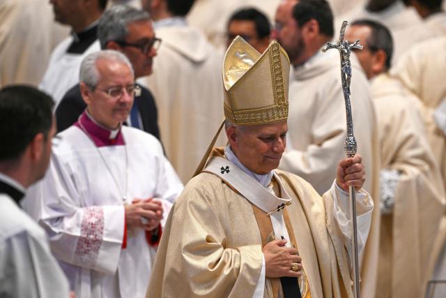 Pope Leo XIV (C) leaves after presiding the Holy Mass with Priestly Ordinations, at St Peter's Basilica in the Vatican on April 26, 2026. (Photo by Andreas SOLARO / AFP)