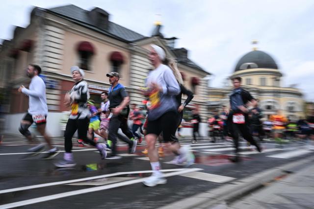 Participants of the Moscow Half Marathon run along Bolshaya Ordynka street past the Church of Our Lord and Sorrow in central Moscow on April 26, 2026. (Photo by Igor IVANKO / AFP)