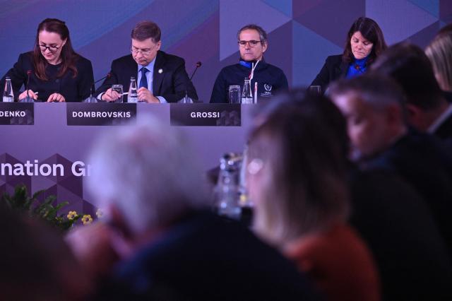 Chief of the U.N.s International Atomic Energy Agency (IAEA) Rafael Mariano Grossi (2ndR), EU Commissioner for Economy and Productivity, Implementation and Simplification Valdis Dombrovskis (2ndL) and Ukraine's Prime Minister Yulia Svyrydenko (L) attend Ukraine Energy Coordination Group summit on the 40th anniversary of the explosion at the Chernobyl nuclear power plant, in Kyiv on April 26, 2026, amid the Russian invasion of Ukraine. Ukraine on April 26, 2026, marks the 40th anniversary of the explosion at the Chernobyl nuclear power plant. It comes four years into the Russian invasion that has put the plant once again under threat and raised risks of another radioactive catastrophe. The 1986 explosion at the Chernobyl nuclear power plant was the worst civilian nuclear disaster in history and changed global perceptions of nuclear energy. (Photo by Sergei SUPINSKY / AFP)