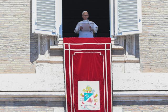 Pope Leo XIV delivers his speech from the window of the apostolic palace overlooking St. Peter's square during the Regina Coeli prayer in The Vatican on April 26, 2025. (Photo by Andreas SOLARO / AFP)