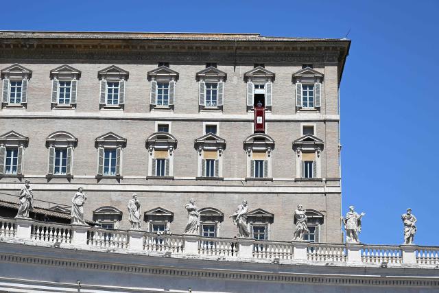 Pope Leo XIV delivers his speech from the window of the apostolic palace overlooking St. Peter's square during the Regina Coeli prayer in The Vatican on April 26, 2025. (Photo by Andreas SOLARO / AFP)