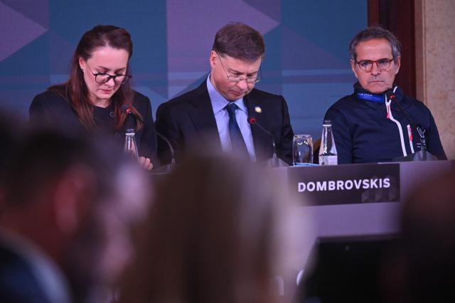 (R-L) Chief of the U.N.s International Atomic Energy Agency (IAEA) Rafael Mariano Grossi, EU Commissioner for Economy and Productivity, Implementation and Simplification Valdis Dombrovskis and Ukraine's Prime Minister Yulia Svyrydenko attend Ukraine Energy Coordination Group summit on the 40th anniversary of the explosion at the Chernobyl nuclear power plant, in Kyiv on April 26, 2026, amid the Russian invasion of Ukraine. Ukraine on April 26, 2026, marks the 40th anniversary of the explosion at the Chernobyl nuclear power plant. It comes four years into the Russian invasion that has put the plant once again under threat and raised risks of another radioactive catastrophe. The 1986 explosion at the Chernobyl nuclear power plant was the worst civilian nuclear disaster in history and changed global perceptions of nuclear energy. (Photo by Sergei SUPINSKY / AFP)