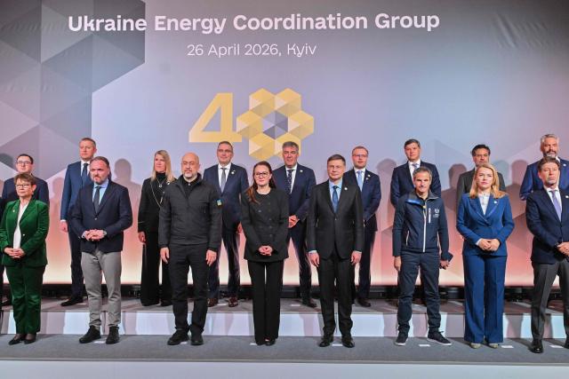 Chief of the U.N.s International Atomic Energy Agency (IAEA) Rafael Mariano Grossi (front 3rd R), EU Commissioner for Economy and Productivity, Implementation and Simplification Valdis Dombrovskis (front 4th R), Ukraine's Prime Minister Yulia Svyrydenko (front C), Minister of Energy of Ukraine Denys Shmyhal (C-L) pose with other guests for a group photograph during Ukraine Energy Coordination Group summit on the 40th anniversary of the explosion at the Chernobyl nuclear power plant, in Kyiv on April 26, 2026, amid the Russian invasion of Ukraine. Ukraine on April 26, 2026, marks the 40th anniversary of the explosion at the Chernobyl nuclear power plant. It comes four years into the Russian invasion that has put the plant once again under threat and raised risks of another radioactive catastrophe. The 1986 explosion at the Chernobyl nuclear power plant was the worst civilian nuclear disaster in history and changed global perceptions of nuclear energy. (Photo by Sergei SUPINSKY / AFP)