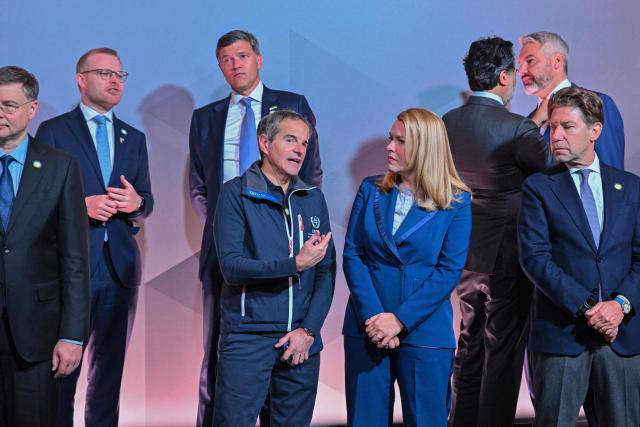 Chief of the U.N.s International Atomic Energy Agency (IAEA) Rafael Mariano Grossi (C) attends the Ukraine Energy Coordination Group summit on the 40th anniversary of the explosion at the Chernobyl nuclear power plant, in Kyiv on April 26, 2026, amid the Russian invasion of Ukraine. Ukraine on April 26, 2026, marks the 40th anniversary of the explosion at the Chernobyl nuclear power plant. It comes four years into the Russian invasion that has put the plant once again under threat and raised risks of another radioactive catastrophe. The 1986 explosion at the Chernobyl nuclear power plant was the worst civilian nuclear disaster in history and changed global perceptions of nuclear energy. (Photo by Sergei SUPINSKY / AFP)