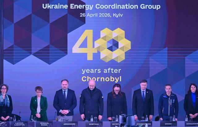 Participants including (From L) France's Special Envoy of the President of the French Republic for Ukraine's Relief and Reconstruction Muriel Lacoue-Labarthe and President of the European Bank for Reconstruction and Development (BERD) Odile Renaud-Basso, European Commissioner for Energy and Housing Dan Jørgensen, Ukraine's Minister of Energy Denys Shmyhal, Ukraine's Prime Minister Yulia Svyrydenko, EU Commissioner for Economy and Productivity, Implementation and Simplification Valdis Dombrovskis, chief of the U.N.s International Atomic Energy Agency (IAEA) Rafael Mariano Grossi and European Commission's Deputy Director-General for the Directorate-General for Energy Mechthild Wörsdörfer attend Ukraine Energy Coordination Group summit on the 40th anniversary of the explosion at the Chernobyl nuclear power plant, in Kyiv on April 26, 2026, amid the Russian invasion of Ukraine. Ukraine on April 26, 2026, marks the 40th anniversary of the explosion at the Chernobyl nuclear power plant. It comes four years into the Russian invasion that has put the plant once again under threat and raised risks of another radioactive catastrophe. The 1986 explosion at the Chernobyl nuclear power plant was the worst civilian nuclear disaster in history and changed global perceptions of nuclear energy. (Photo by Sergei SUPINSKY / AFP)