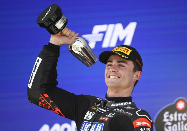 Second placed Liqui Moly Dynavolt Intact GP team's Spanish moto2 rider Manuel Gonzalez celebrates on the podium of the Moto2 Spanish Grand Prix race at the Jerez racetrack in Jerez de la Frontera on April 26, 2026. (Photo by JORGE GUERRERO / AFP)