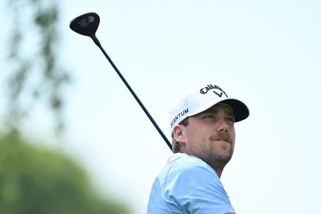 Sweden’s Mikael Lindberg watches his shot during the final round of the China Open golf tournament in Shanghai on April 26, 2026. (Photo by CN-STR / AFP) / China OUT
