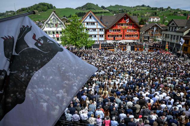 Citizens take part in the Landsgemeinde, a traditional public, non-secret ballot conducted by majority rule, in Appenzell, eastern Switzerland, on April 26, 2026. The open-air gathering, held annually, allows eligible citizens to decide cantonal laws and policies directly, preserving one of Switzerland’s oldest forms of direct democracy. (Photo by Fabrice COFFRINI / AFP)