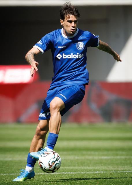 Gent's Portugese defender Tiago Filipe Alves Araújo runs with the ball during the Belgian "Pro League" First Division football match between KAA Gent and Club Brugge at KAA Gent Stadium in Gent on April 26, 2026. (Photo by KURT DESPLENTER / Belga / AFP) / Belgium OUT