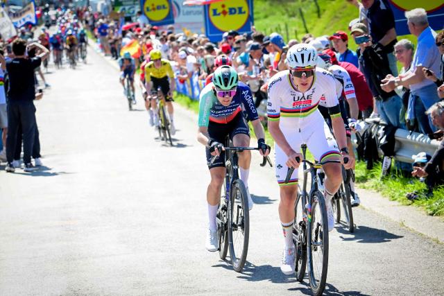 UAE Team Emirates-XRG's Slovenian rider Tadej Pogacar (R) and Decathlon CMA-CGM Team's French rider Paul Seixas cycle during the men elite race of the Liege-Bastogne-Liege UCI World Tour one day cycling race, 259.5km from Liege, over Bastogne to Liege, on April 26, 2026. (Photo by Bernard PAPON / various sources / AFP) / Belgium OUT