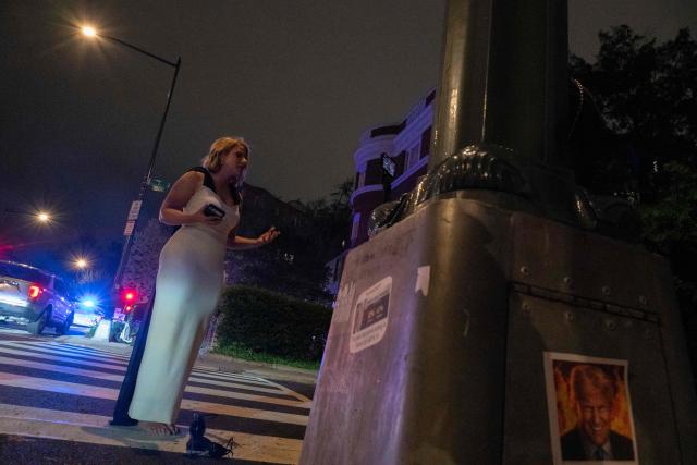 A TV correspondent makes a live presentation outside the Hilton Hotel after an armed gunman rushed past a security control post inside the hotel and near where  the White House Correspondents dinner was taking place at the Washington Hilton in Washington, DC, on April 25, 2025. Shots were fired as US President Donald Trump attended a media gala in Washington on Saturday night, with the gunman detained at a screening area just outside the hotel ballroom where hundreds of guests had gathered. (Photo by ROBERTO SCHMIDT / AFP)
