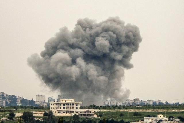 Smoke rises from targeted areas in the town of Choukîne, in Lebanon Nabatieh province following an airstrike, on April 26, 2026. Lebanon was drawn into the Middle East war on March 2 when Tehran-backed militant group Hezbollah launched attacks on Israel to avenge the killing of the Iranian leader. Israel has responded with broad strikes across Lebanon and a ground offensive. (Photo by AFP stringer / AFP)