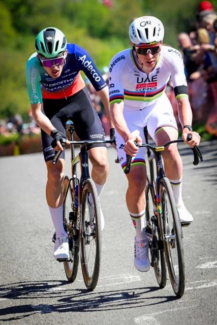 Decathlon CMA-CGM Team's French rider Paul Seixas (L) and UAE Team Emirates-XRG's Slovenian rider Tadej Pogacar cycle during the men elite race of the Liege-Bastogne-Liege UCI World Tour one day cycling race, 259,5km from Liege, over Bastogne to Liege, on April 26, 2026. (Photo by Bernard PAPON / various sources / AFP) / Belgium OUT