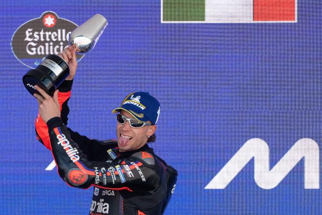 Second placed Aprilia Racing team's Italian MotoGP rider Marco Bezzecchi celebrates on the podium of the MotoGP Spanish Grand Prix race at the Jerez racetrack in Jerez de la Frontera on April 26, 2026. (Photo by JORGE GUERRERO / AFP)