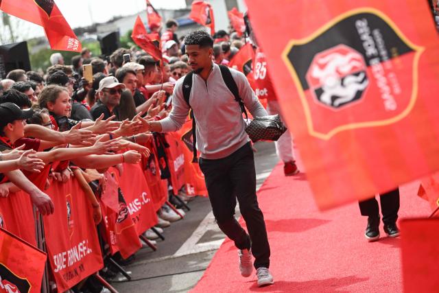 Rennes French forward #10 Ludovic Blas shakes hands with supporters as he arrives for the French L1 football match between Stade Rennais FC and FC Nantes at the Roazhon Park stadium in Rennes, on April 26, 2026. . (Photo by Sebastien Salom-Gomis / AFP)