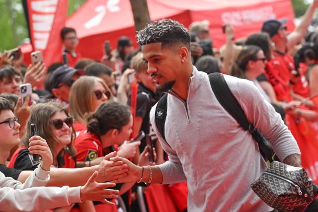 Rennes French forward #10 Ludovic Blas shakes hands with supporters as he arrives for the French L1 football match between Stade Rennais FC and FC Nantes at the Roazhon Park stadium in Rennes, on April 26, 2026. . (Photo by Sebastien Salom-Gomis / AFP)