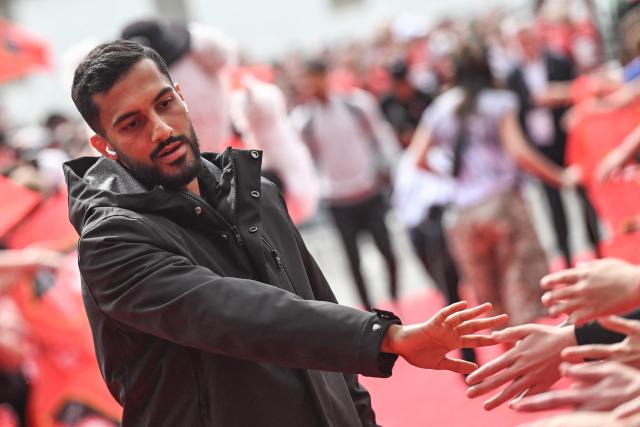 Rennes' Jordanian forward #11 Mousa Al-Tamari shakes hands with supporters as he arrives for the French L1 football match between Stade Rennais FC and FC Nantes at the Roazhon Park stadium in Rennes, on April 26, 2026. . (Photo by Sebastien Salom-Gomis / AFP)