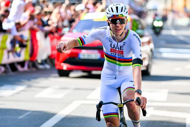 UAE Team Emirates-XRG's Slovenian rider Tadej Pogacar celebrates as he crosses the finish line to win the men's elite race of the Liege-Bastogne-Liege UCI World Tour one day cycling race, 259.5km from Liege, over Bastogne to Liege, on April 26, 2026. (Photo by ERIC LALMAND / Belga / AFP) / Belgium OUT