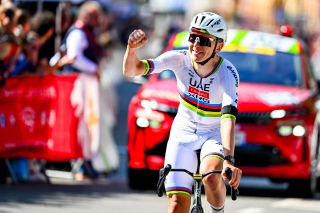 UAE Team Emirates-XRG's Slovenian rider Tadej Pogacar celebrates as he crosses the finish line to win the men's elite race of the Liege-Bastogne-Liege UCI World Tour one day cycling race, 259.5km from Liege, over Bastogne to Liege, on April 26, 2026. (Photo by ERIC LALMAND / Belga / AFP) / Belgium OUT