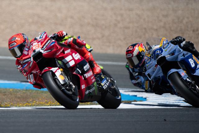 Team Ducati Lenovo Team's Marc Marquez competes with Team Gresini Racing MotoGP's Alex Marquez during the MotoGP Spanish Grand Prix at the Jerez racetrack in Jerez de la Frontera, on April 26, 2025. (Photo by JORGE GUERRERO / AFP)
