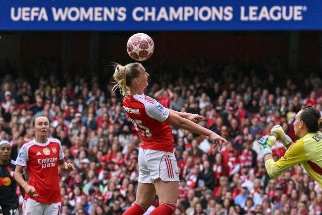 Arsenal's Swedish striker #25 Stina Blackstenius (C) heads the ball during the women's UEFA Champions League first-leg semi-final football match between Arsenal and OL Lyonnes at the Emirates Stadium, north London, on April 26, 2026. (Photo by Glyn KIRK / AFP)
