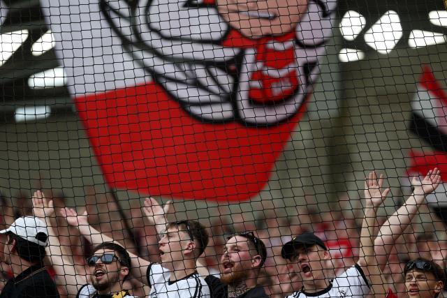 Lille's supporters cheer their team on from the stands at the end of the French L1 football match between Paris FC and LOSC Lille at the Stade Jean-Bouin in Paris, on April 26, 2026. (Photo by FRANCK FIFE / AFP)