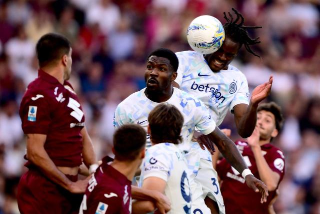 Inter Milan's German defender #31 Yann Aurel Bisseck (2R) heads the ball to score Inter's second goal during the Italian Serie A football match between Torino and Inter Milan at the Olympic Stadium Grande Torino in Turin on April 26, 2026. (Photo by MARCO BERTORELLO / AFP)