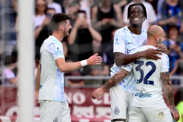 Inter Milan's German defender #31 Yann Aurel Bisseck (2R) celebrates with teammates after scoring Inter's second goal during the Italian Serie A football match between Torino and Inter Milan at the Olympic Stadium Grande Torino in Turin on April 26, 2026. (Photo by MARCO BERTORELLO / AFP)