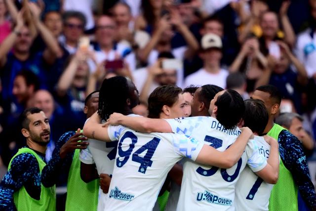 Inter Milan's players celebrate after scoring their second goal during the Italian Serie A football match between Torino and Inter Milan at the Olympic Stadium Grande Torino in Turin on April 26, 2026. (Photo by MARCO BERTORELLO / AFP)