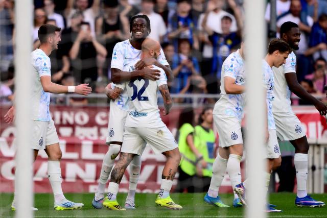 Inter Milan's German defender #31 Yann Aurel Bisseck (2L) celebrates with teammates after scoring Inter's second goal during the Italian Serie A football match between Torino and Inter Milan at the Olympic Stadium Grande Torino in Turin on April 26, 2026. (Photo by MARCO BERTORELLO / AFP)