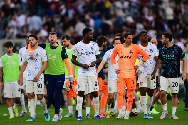 Inter Milan's players reacts at the end of the Italian Serie A football match between Torino and Inter Milan at the Olympic Stadium Grande Torino in Turin on April 26, 2026. (Photo by MARCO BERTORELLO / AFP)